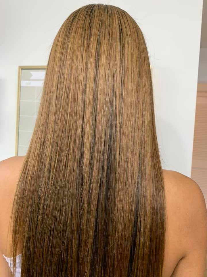 Sleek honey-toned smooth blowout