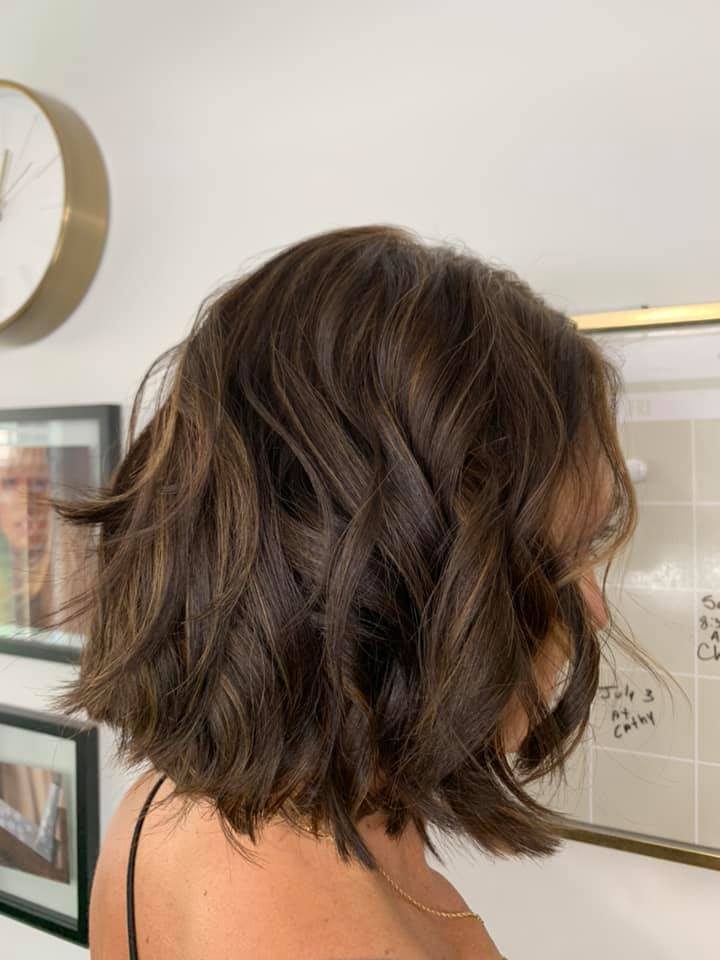Dimensional brunette bob with soft waves